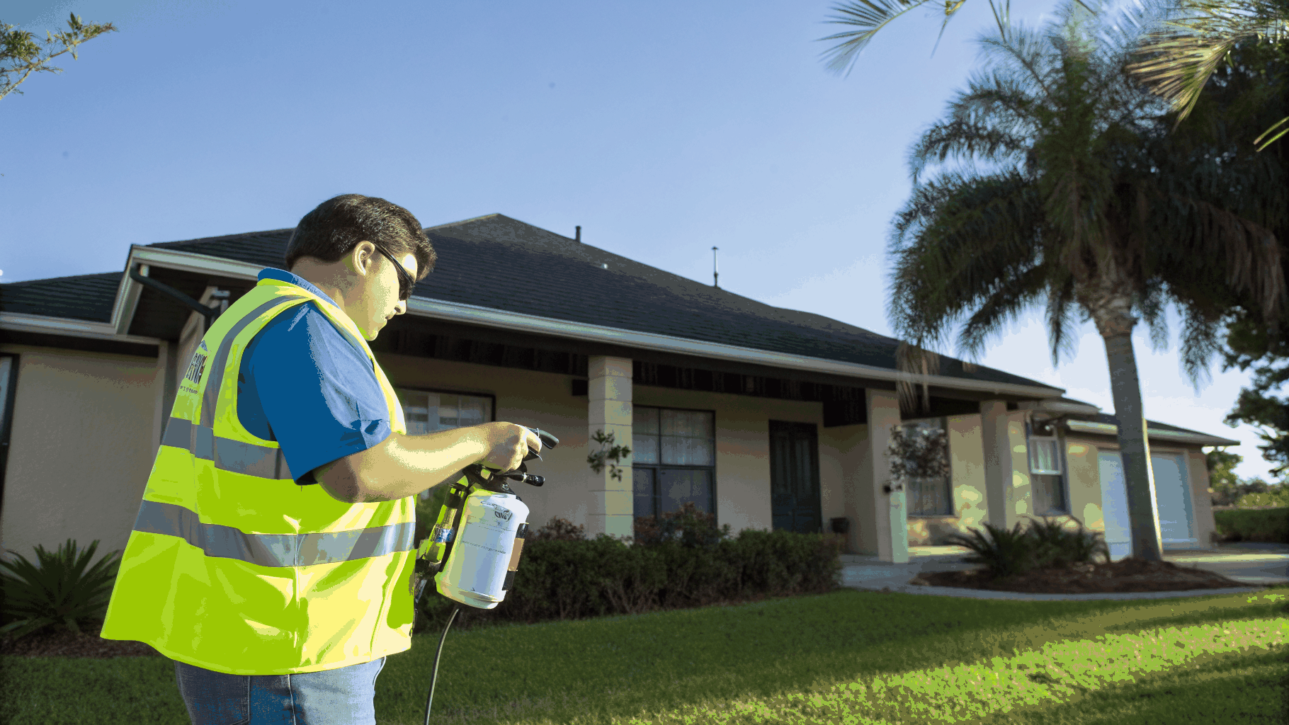 Professional pest control technician conducting a property inspection
