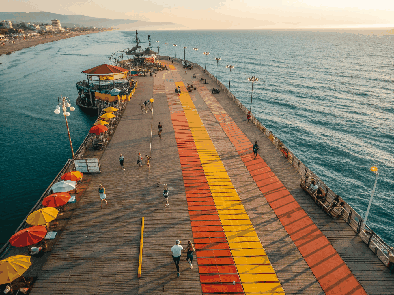 Scenic wide landscape view of the Huntington Beach Pier along the Pacific Ocean coastline in California