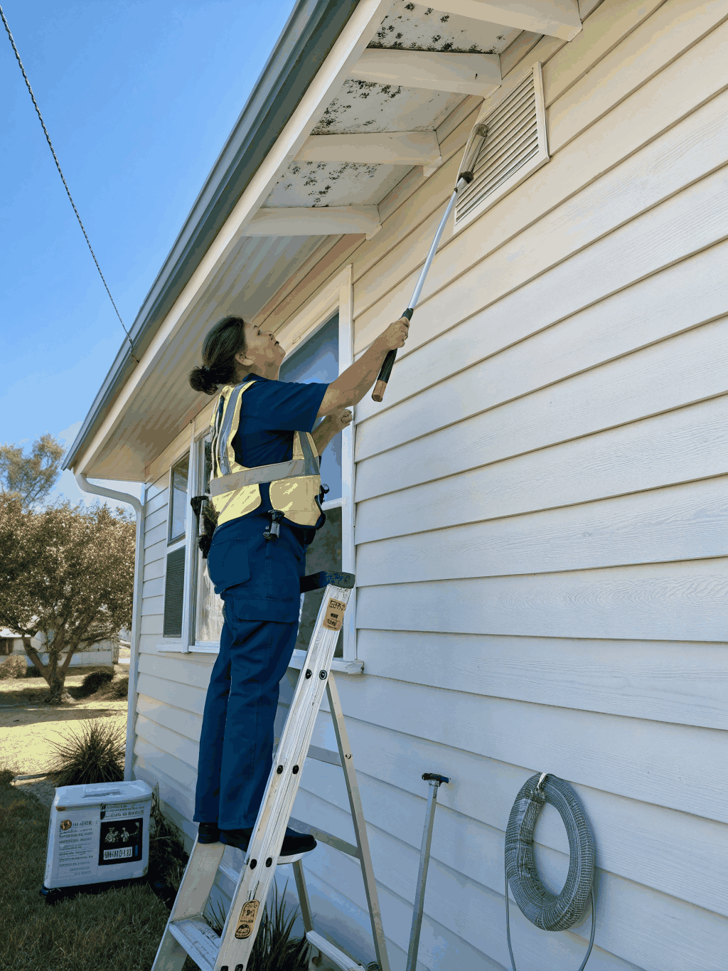 Professional pest control technician conducting a property inspection